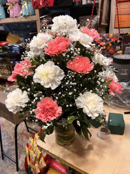 Carnations Arrangement In Glass Vase
