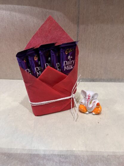 Small Ganesha Idol With Chocolates
