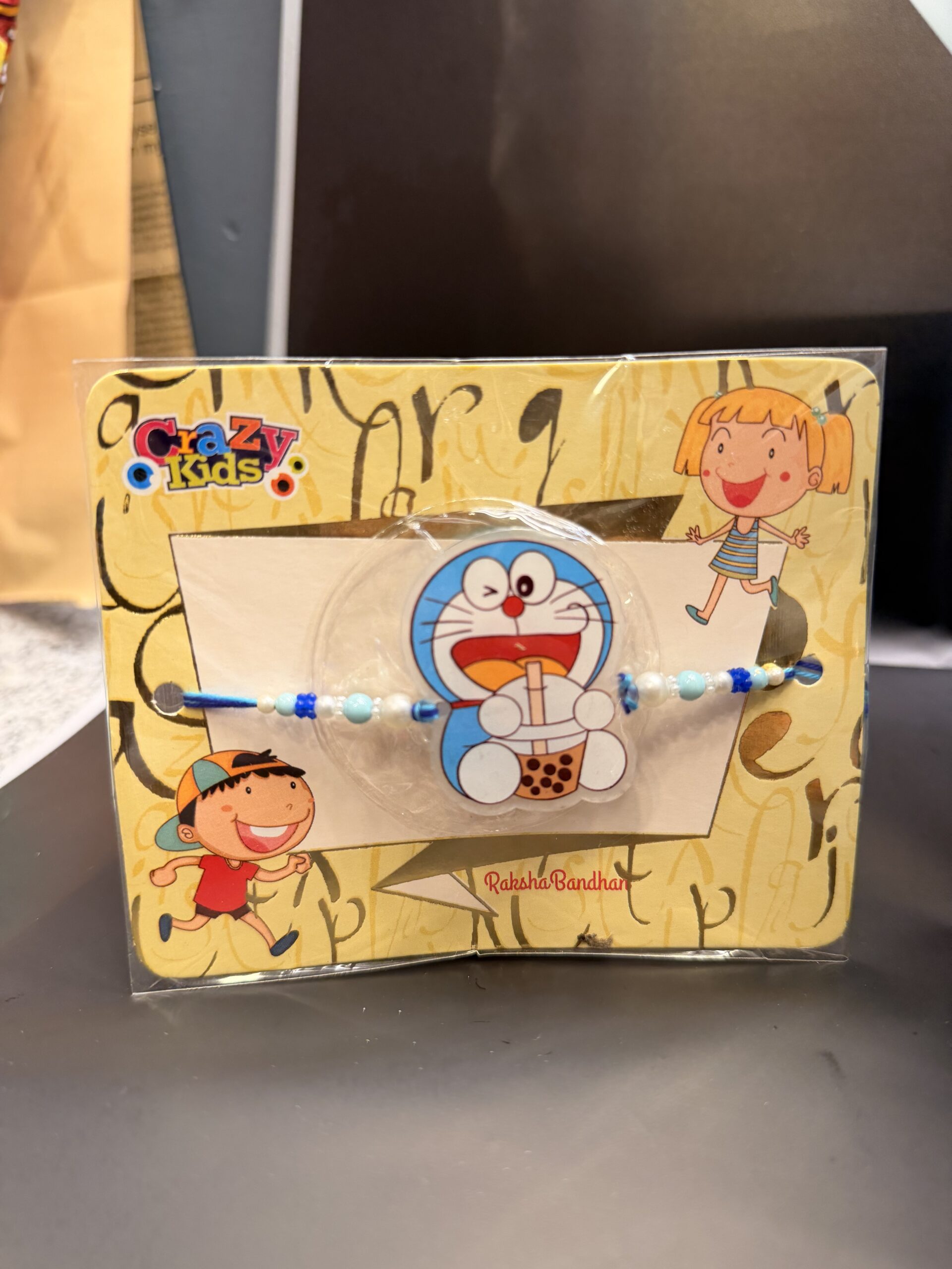 Doraemon Kids Light Rakhi With Kinder joy - Image 2