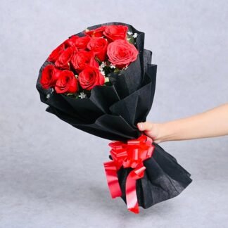 12 Red Roses In Black Paper