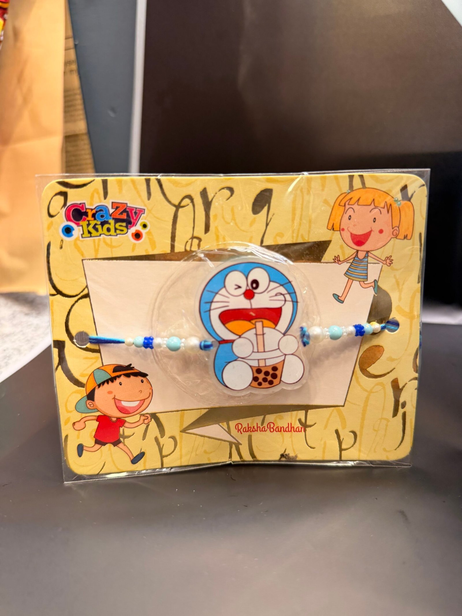 Doraemon Kids Light Rakhi With Kinder joy - Image 2