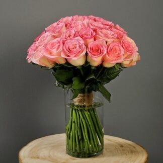 Elegant Pink Roses In Glass Vase